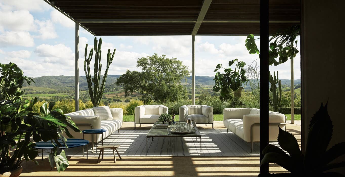 Architect's workspace with B&B Italia outdoor catalog and swatches