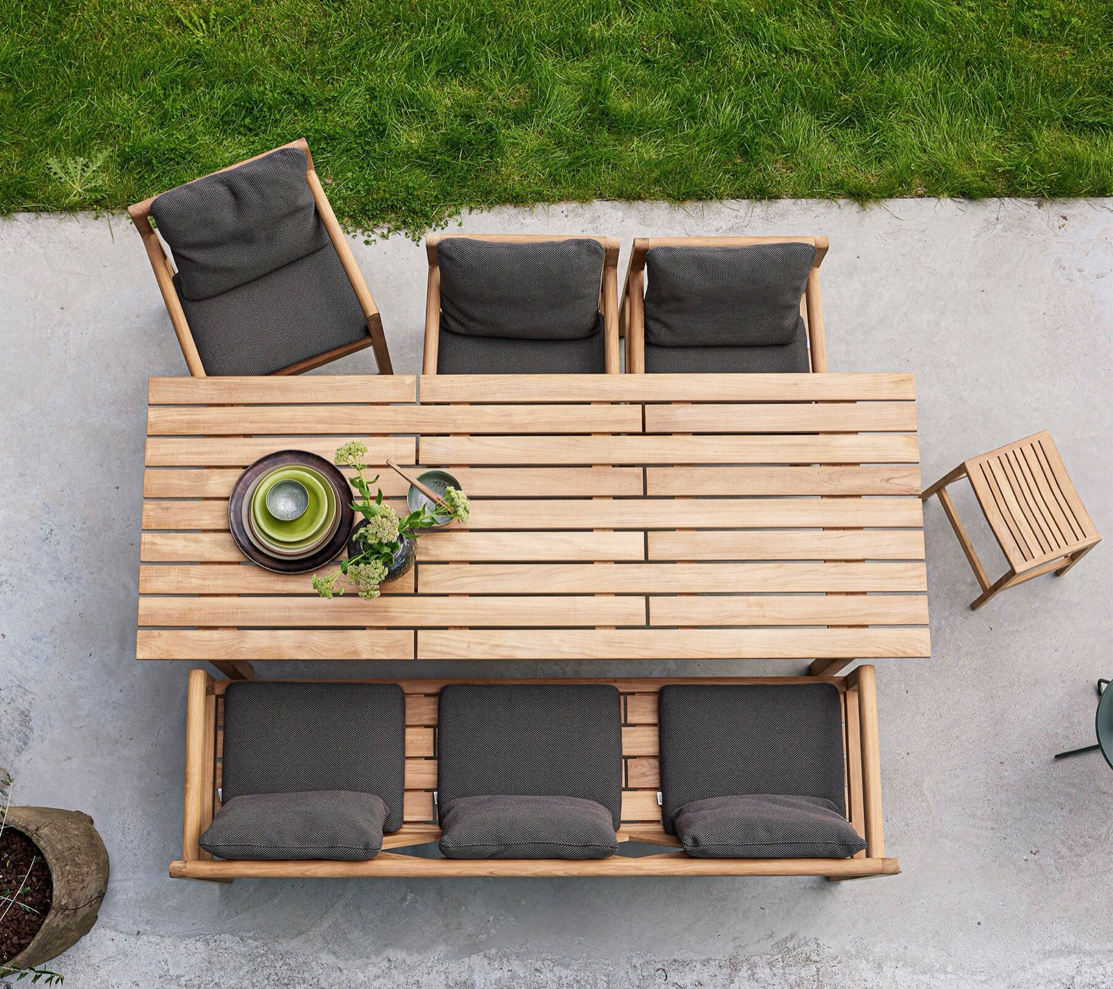 Cane-line Grace teak dining set viewed from above on a lawn