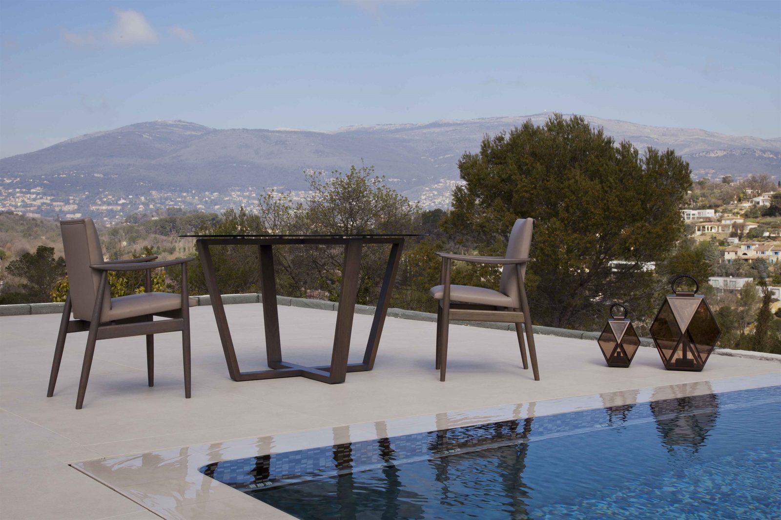 Meroni & Colzani outdoor furniture on a terrace overlooking the sea